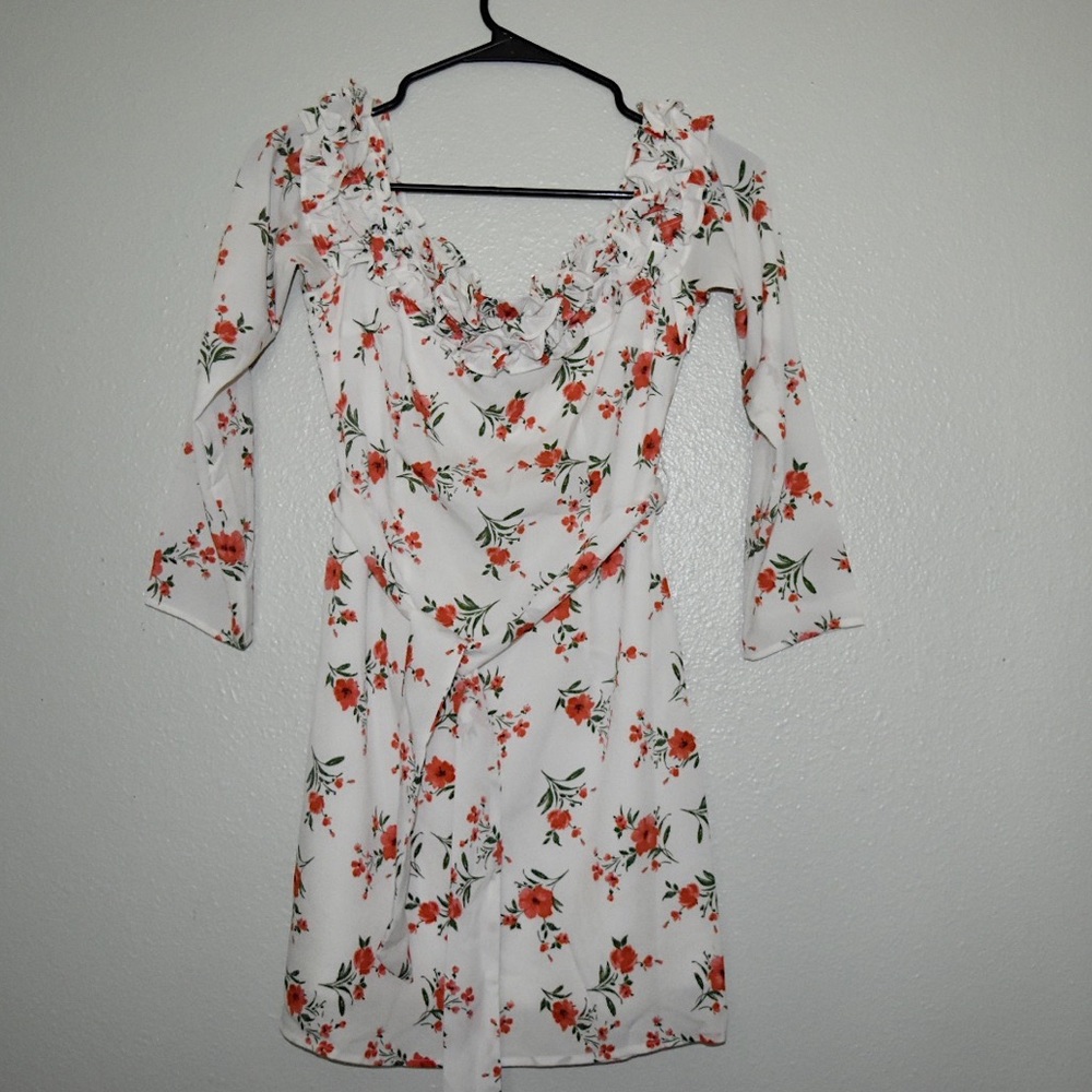White long sleeve mini dress, w red floral print.